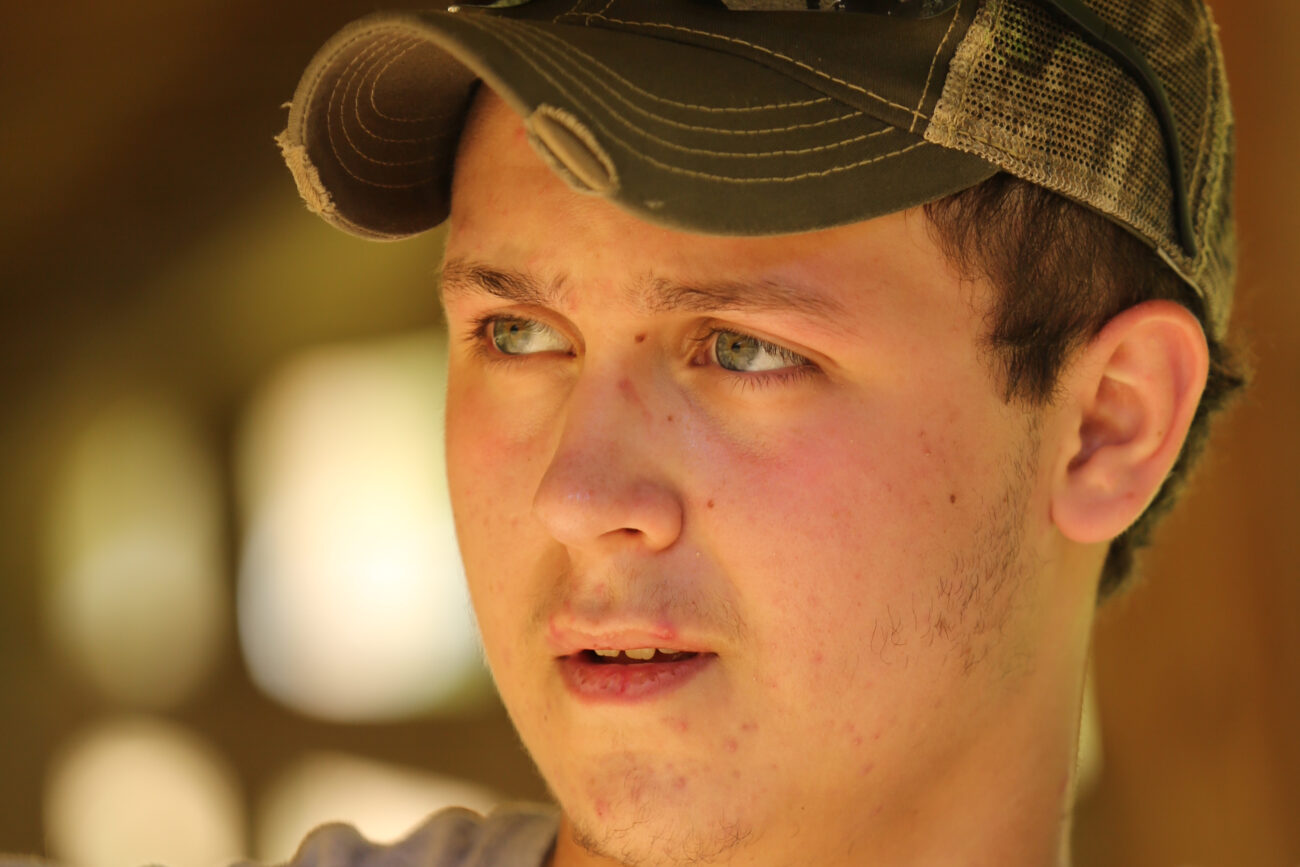 Tanner Horton, 15, has been a resident of Leslie County his entire life. Tanner loves playing bluegrass music and owns 26 guitars. Photo by Emily Wuetcher