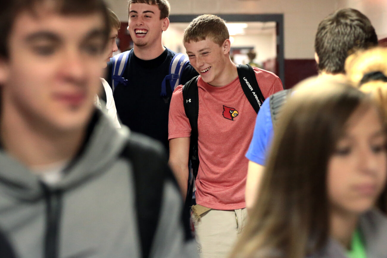 Kevin Whitaker laughs with his friends between classes at Leslie County High School in Hyden, Ky. on Thursday, October 10, 2013. Photo by Adam Pennavaria