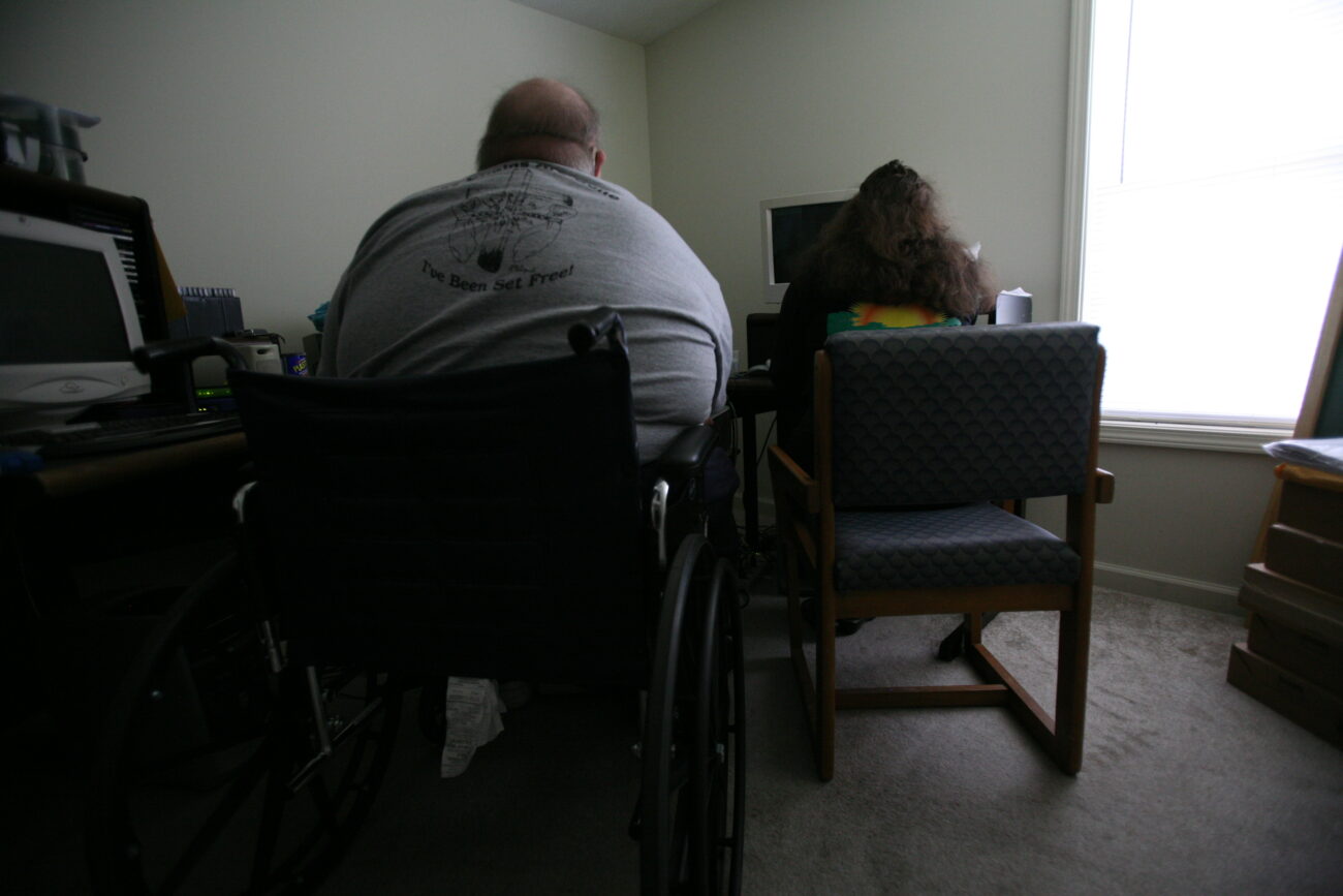 Paula and Shannon Caldwell sit by their computer playing their favorite music. The computer is accessible due to a talking feature that allows them to navigate. Photo by Genevieve Adams