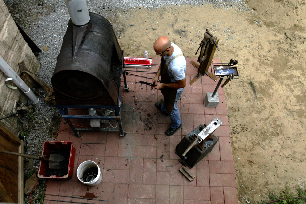 Blacksmith Kevin Blovenkamp works at his portable outdoor forge in Hindman, Kentucky this Thursday,September 17. Blovenkamp has lived in Hindman for the past year, he works with the local Appalachian Artisan group.