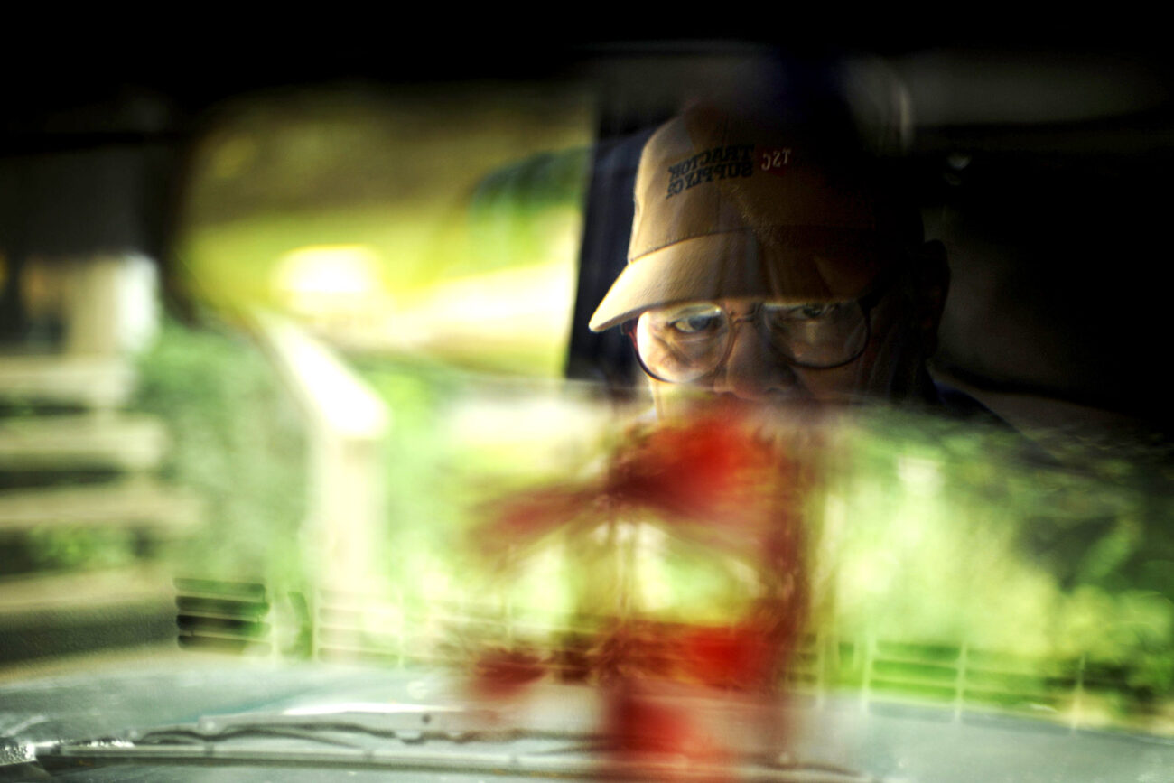 Jim Slone, 53, has had 64 surgeries in his life. In August his heart stop while at the hospital for a kidney transplant and went on life support for five days. 13 days later he was walking again. Jim has no legs...Jim Slone looks in his rear-view mirror while he drives to feed a family members horses.