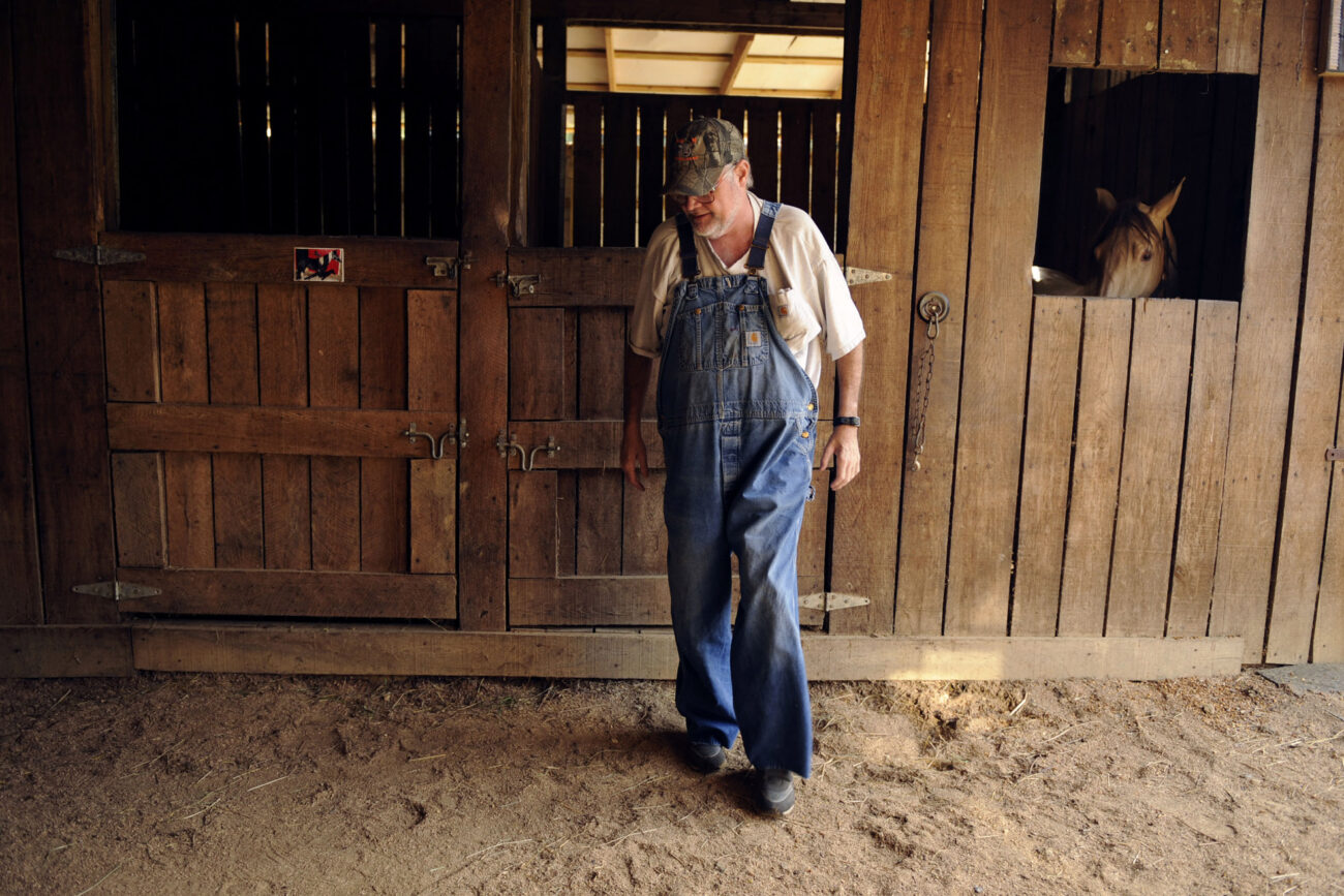 Jim takes a moment to rest after feeding all five horses in a friends barn. Jim and Charlene always are helping out others.