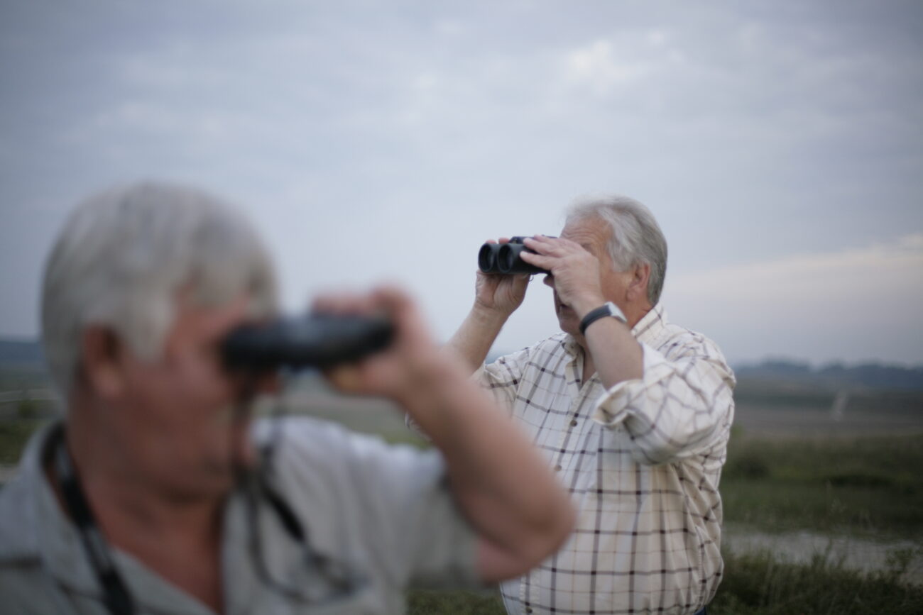 Howard Woolum, right, and James Holland use binoculars to spot elk from a ridge at the Knott County ATV park on Thursday, Sept. 17, 2009. The men had been scouting the elk for over a month in preparation for the upcoming hunting season.