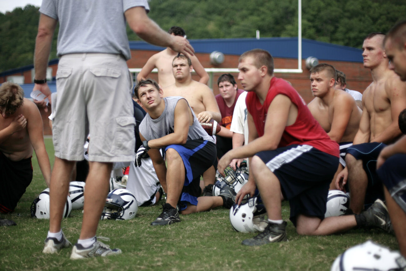 Members of the 2009 Knott County Central High School football team listen to the coach speak after practice on Thursday, Sept. 17, 2009. The team which played the following night, is 1-3 so far this season.