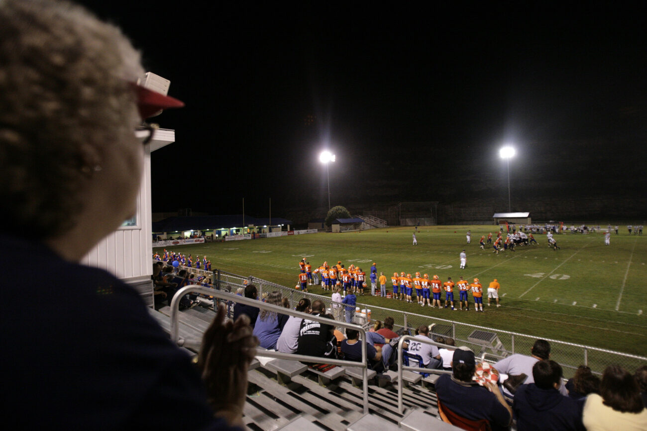 Liz Harlow, left, cheers as she watches the Knott County Central Patriots play Pike County Central on Friday, Sept 18, 2009.