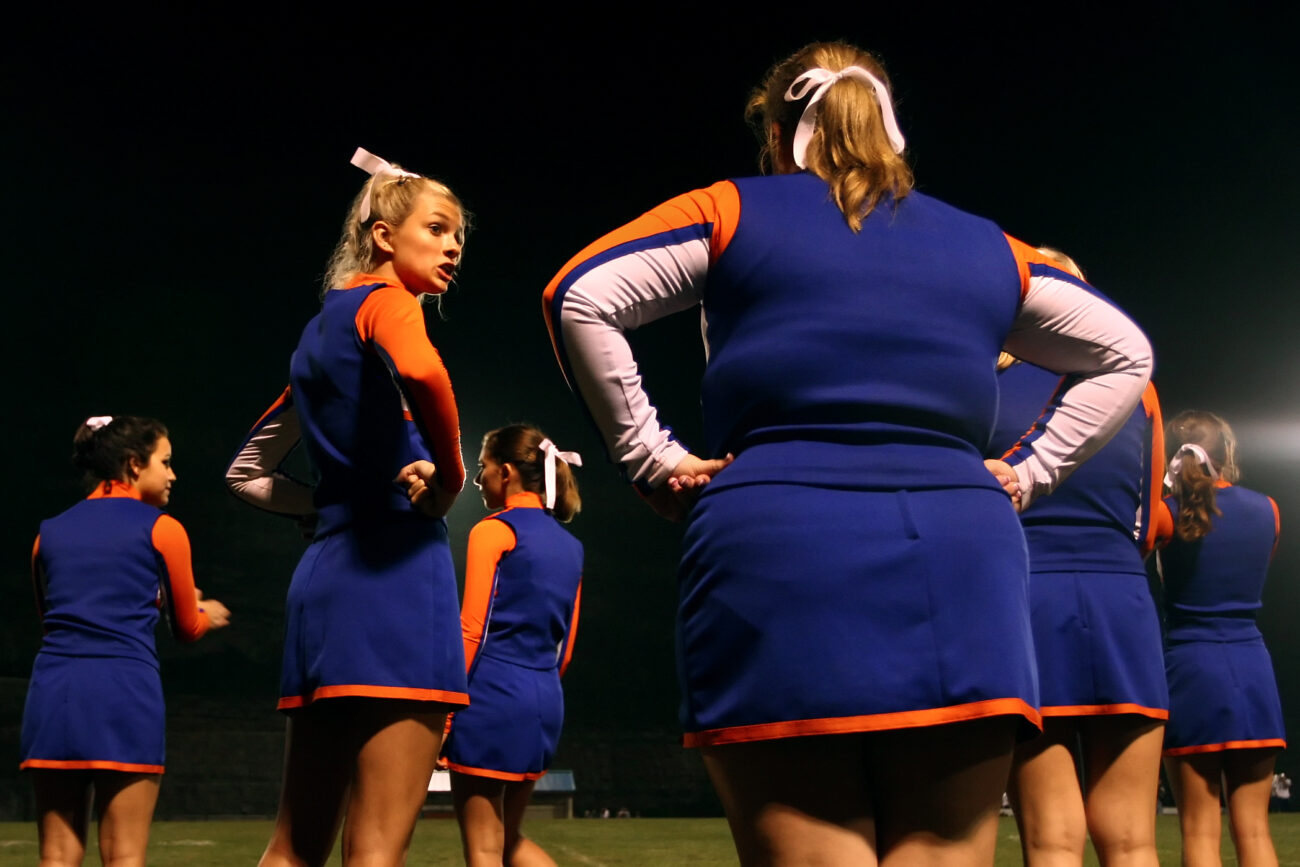The cheerleaders of Pike County Central High School socialize with each other in between plays at their school's homecoming football game against Knott County Central Highschool.