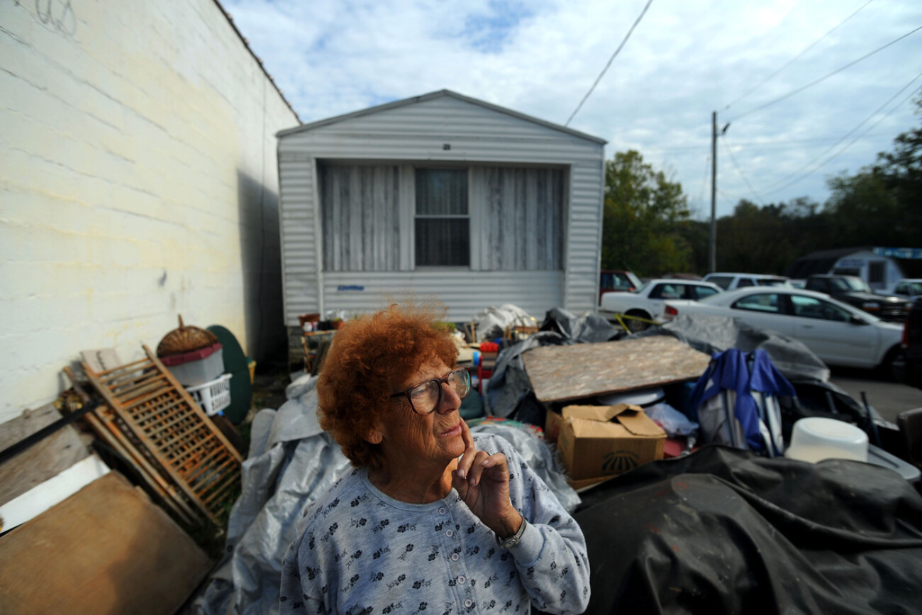 Martha Holland, 76, waits for customers by the sale table next to Vincent's Trading Post, her store on Main Street in Beattyville, Kentucky, September 30, 2010. Martha has spent over 40 years in Beattyville, selling new and used items. Photo by David Foster