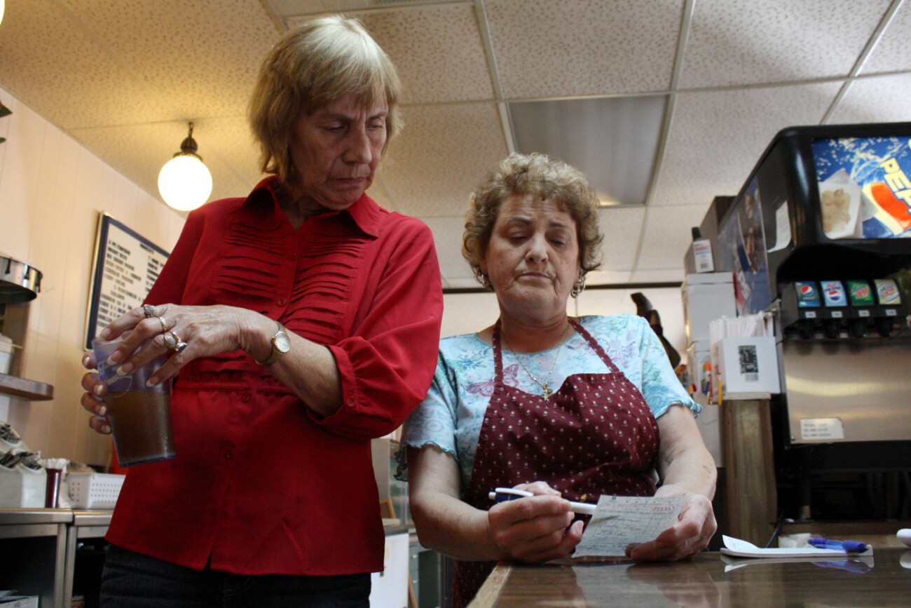 Sylvia _____ asks Nina Million to look over a customer's order. Million also works as a waitress in the restaurant since she is short on staff. Photo by Grace Profancik