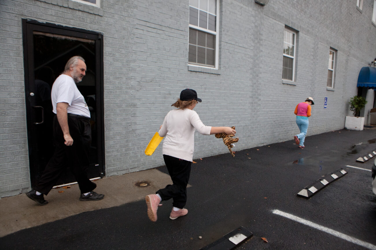 Joseph Hall, left, and his daughters Christina, 11, and Marylynne, 13, get ready to leave the Christian Homeless Shelter in London, KY, for their new home.