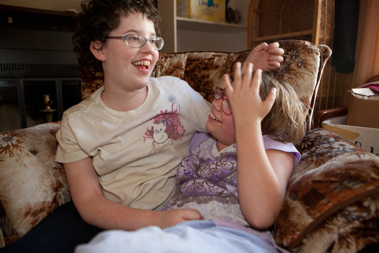 Sisters Marylynne (left), 13, and Christina Hall, 11, enjoy their new home after staying in a homeless shelter with their father.
