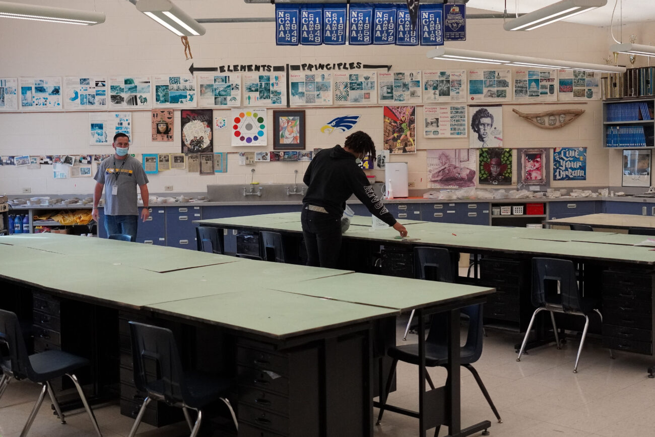 Kaden Moorman is the last to leave class as ceramics teacher Zac Donnelly watches him clean up, in Frankfort, Kentucky, Thursday, Oct. 14, 2021.