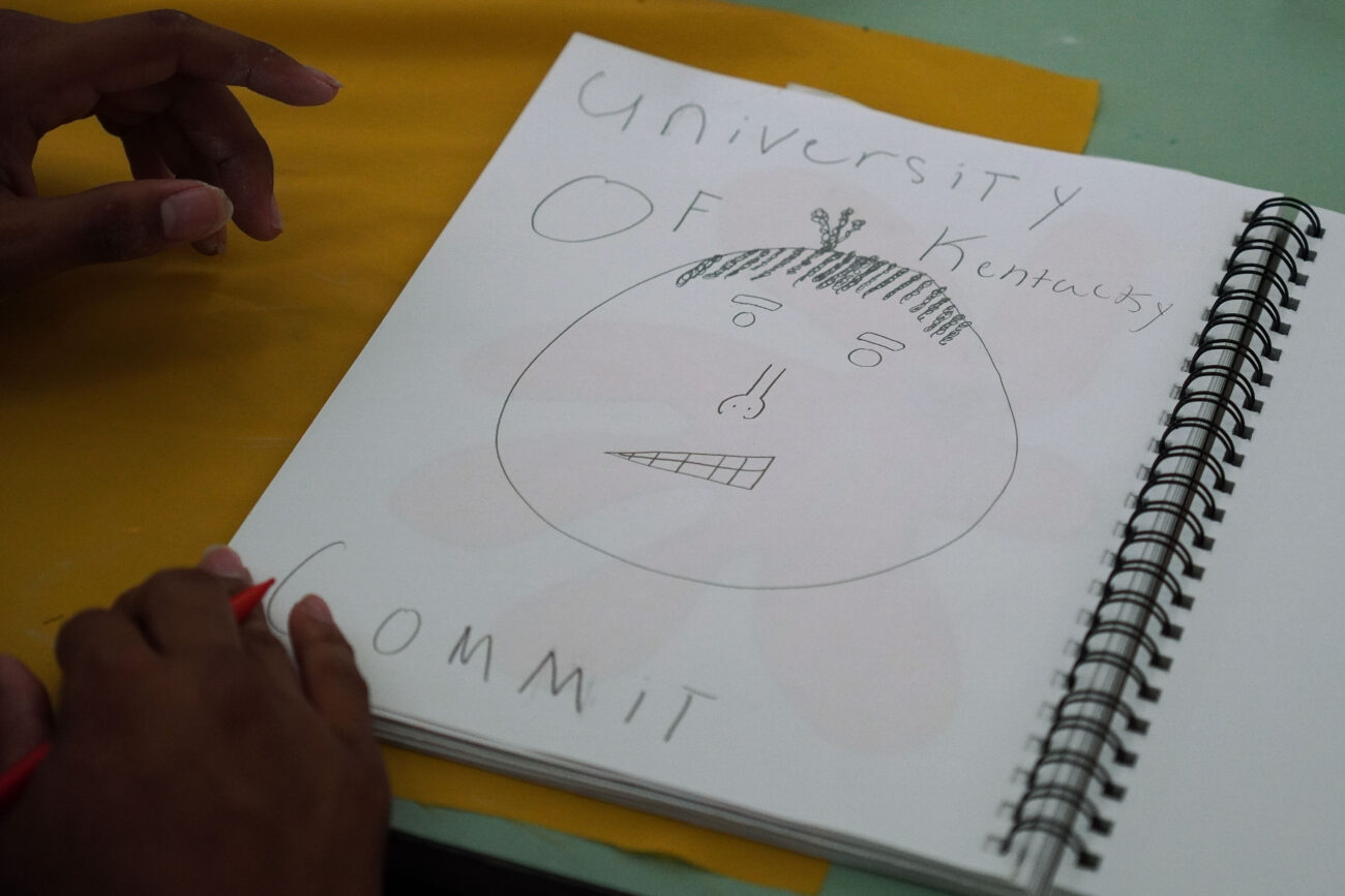 Kaden Moorman draws a picture in ceramics class in Frankfort, Kentucky, Thursday, Oct. 14, 2021. Moorman has committed to play college football for the University of Kentucky.