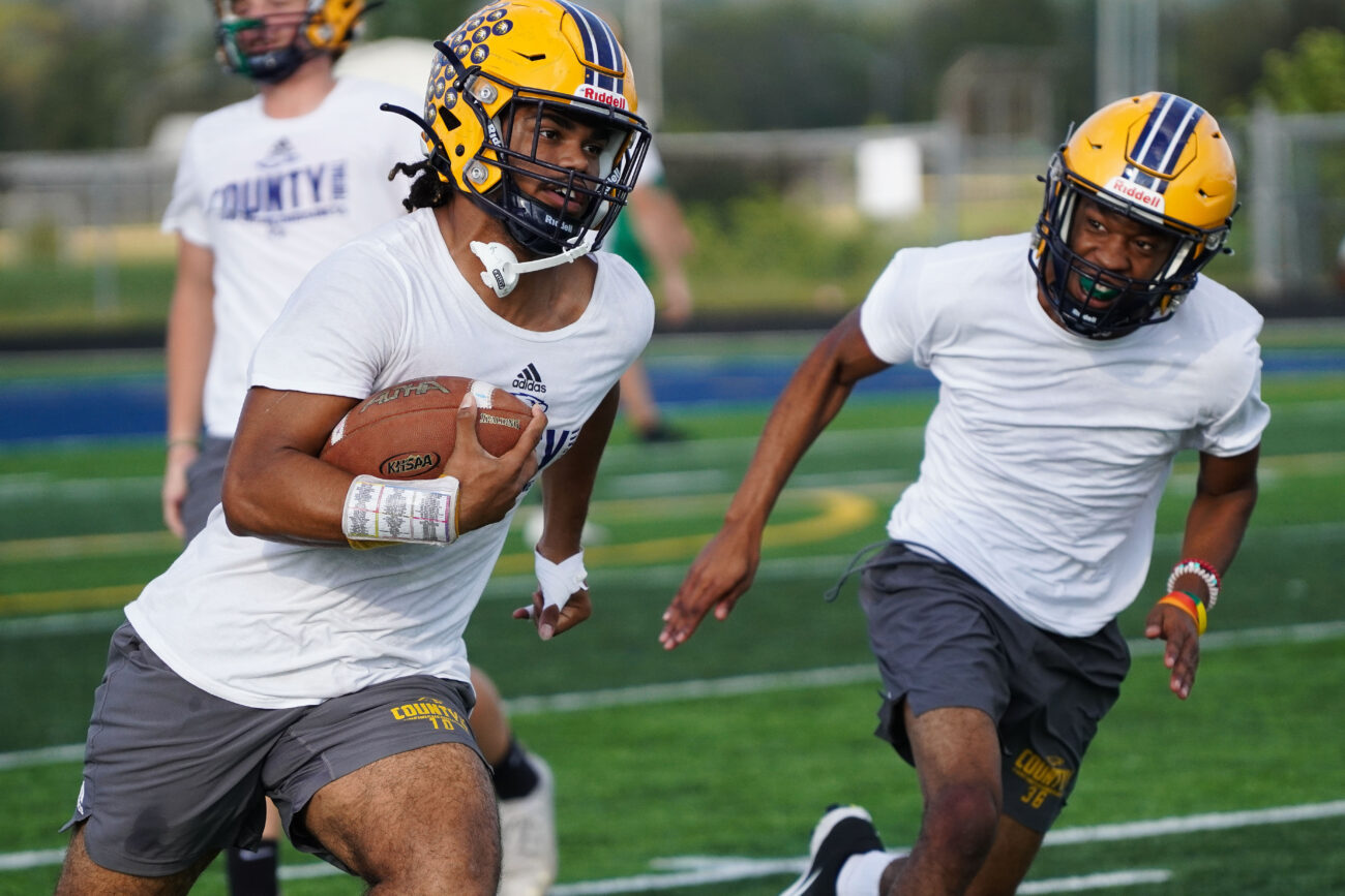 Kaden Moorman runs a play during football practice on the Franklin Flyers’ home football field at Franklin County High School in Frankfort, Kentucky, Thursday, Oct. 14, 2021.