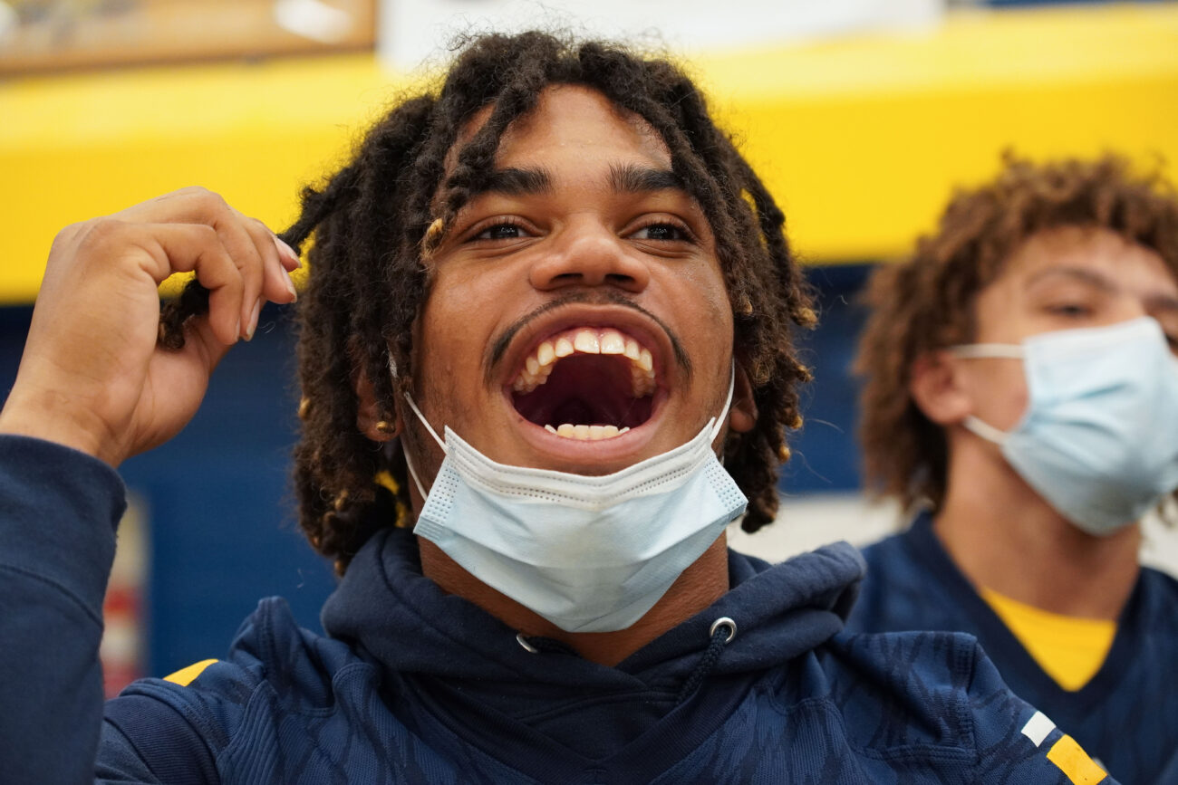 Kaden Moorman cheers in reaction to an event at the Franklin County High School homecoming pep rally in Frankfort, Kentucky, Friday, Oct. 15, 2021.