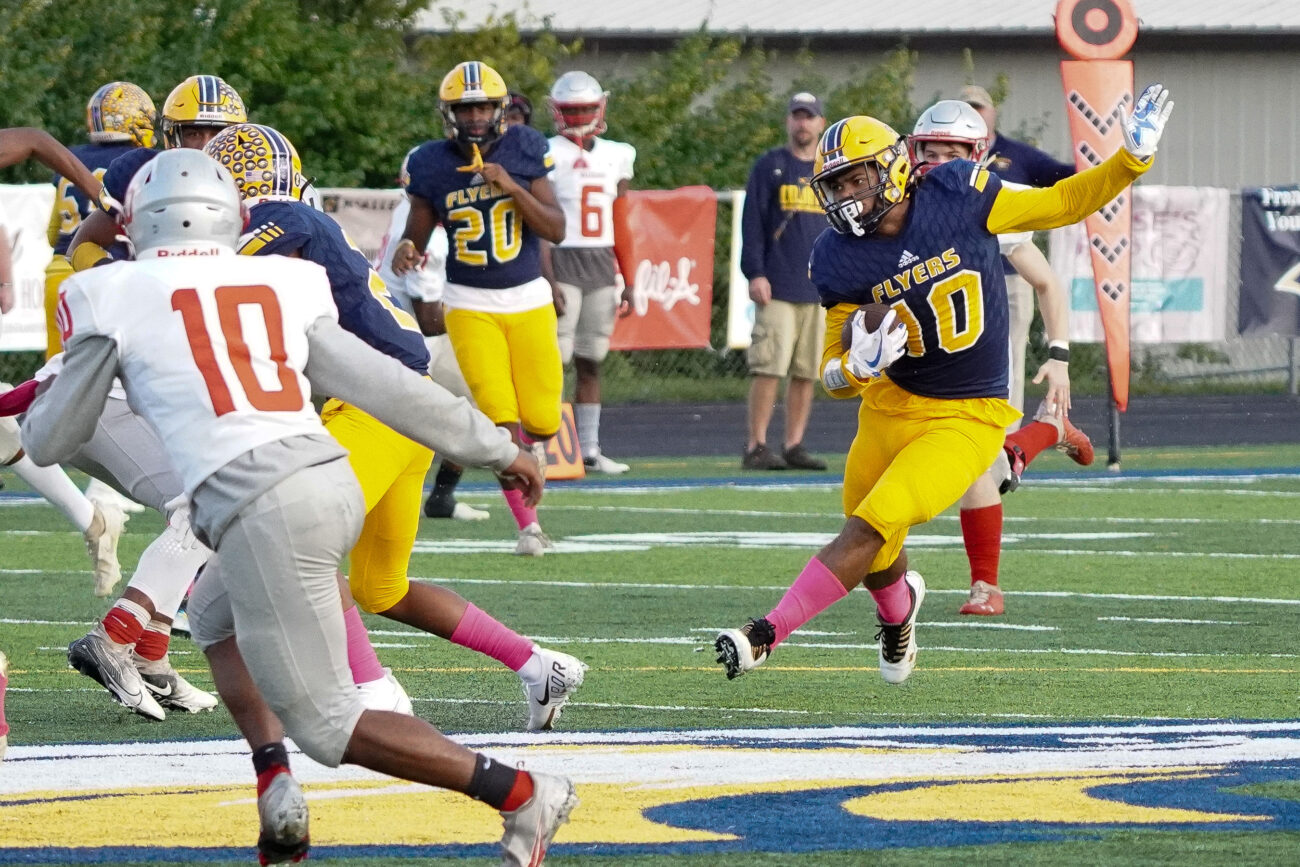 Franklin Flyers running back Kaden Moorman (10) runs the ball downfield in the first quarter in the homecoming football game against the Waggener Wildcats on the Flyers’ home field at Franklin County High School in Frankfort, Kentucky, Friday, Oct. 15, 2021.
