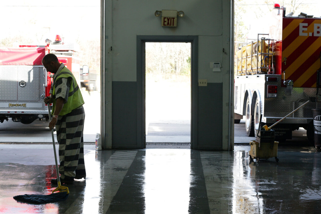 Sam Owens mops the East Bernstadt Fire House floor while on work release from the Laurel County jail. Sam is serving ten years for drug abuse and burglary. When released, he hopes to go back to school at Eastern Kentucky University. Before he was arrested he said he had a 3.9 GPA while getting his Associate's degree. He would like to become a welding teacher at a community college..Photo by Amanda Powell