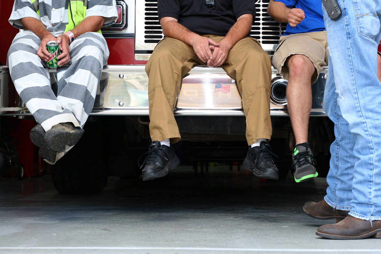 Inmate Sam Owens takes a break with his corrections officer Billy King and community members. Sam is serving ten years for drug abuse and burglary. When released, he hopes to go back to school at Eastern Kentucky University..Photo by Amanda Powell