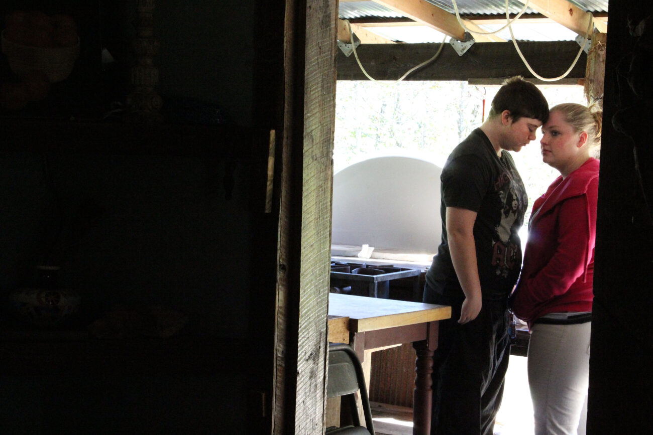 Tori Cantrell, left, lives with her girlfriend Sierra Hylton, right, and Hylton's grandmother on Beyond Yonder Road.  The cabin is almost an hour away from any town. Photo by Morgan Eads