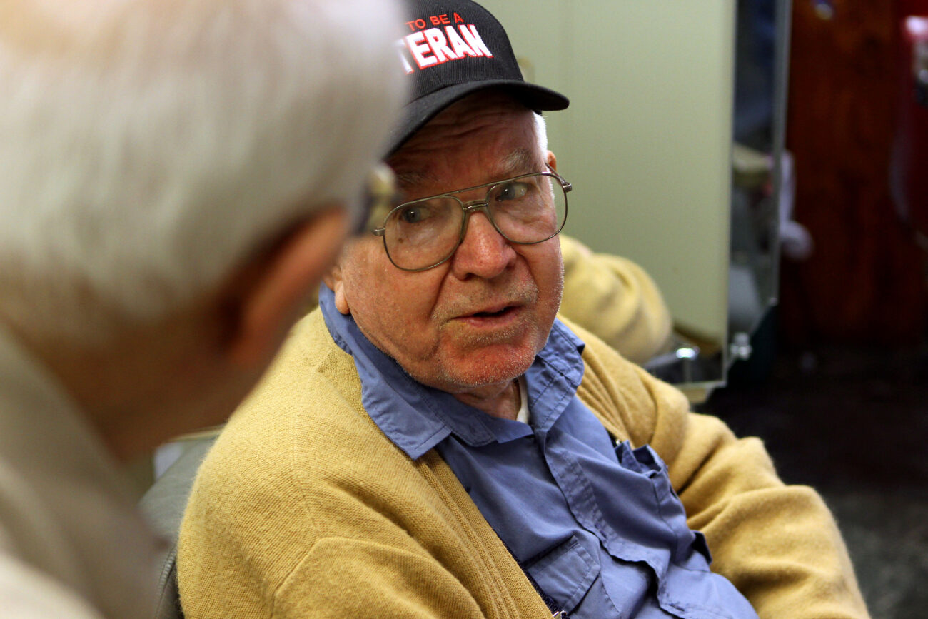 Jim has a conversation with Walden, an 84-year-old veteran who has been coming to shop for years. Walden and Jim spent about 30 minutes discussing the Bible and God. Photo taken at Jim Cloud Barbershop in London, Ky. on October 26, 2012. Photo by Quianna Lige