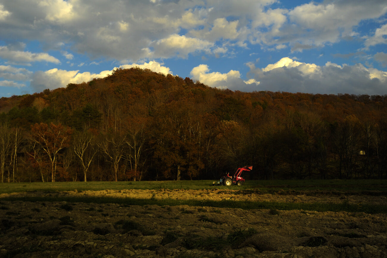 Ford Waterstrat plows a field behind his house near London, Ky., on Friday, Oct. 26, 2012. Waterstrat recently bought the land to expand his Community Supported Agriculture organic farming and said he wants to make it as perfect as he can. After each section, he measures the rows to make sure they are spaced out evenly. Waterstrat's wife Amanda said she's glad the new land is near the house so Ford can be closer when he works.