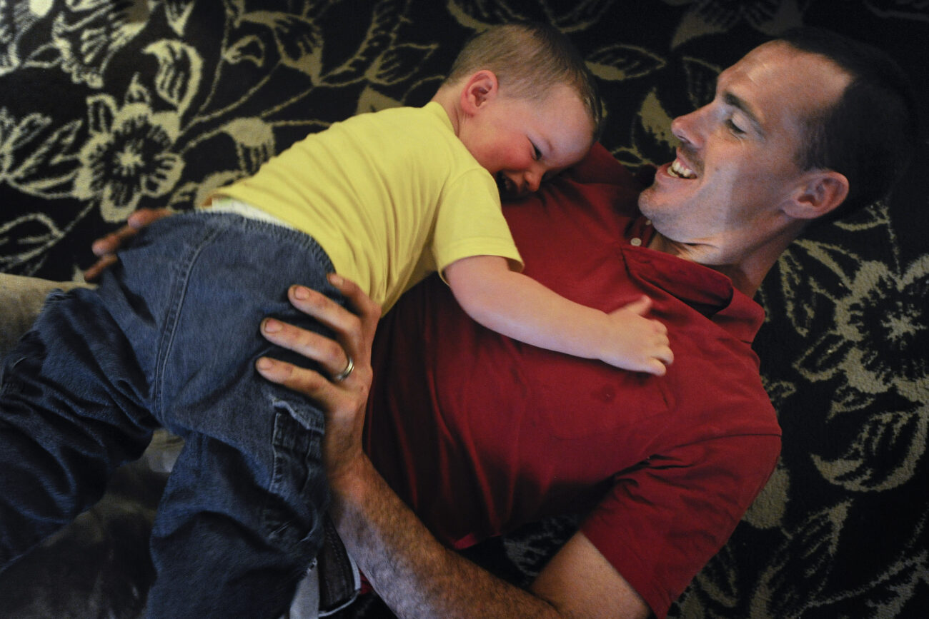 Ford Waterstrat and his son Finley wrestle on the living room floor after the evening's dinner on Friday, Oct. 26, 2012. Waterstrat said that with his busy schedule, he cherishes every minute he has with Finley.