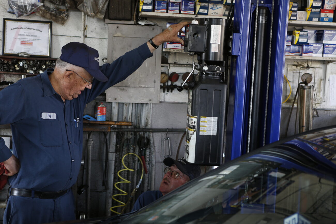 Roy and Jim work side by side in the small two-car garage, where they service vehicles Monday thru Friday, on October 26, 2012. Roy and his employees often disagree about how things are done, but in the end it's Roy's way or the highway. ..Photo by Coty J. Giannelli
