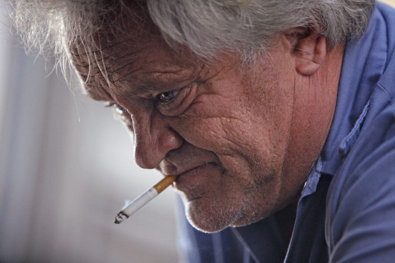 Mechanic Jeff Wright smokes a cigarette while working on a car at TJ Towing in London, Ky., on Friday, Oct. 26, 2012. Photo by Tessa Lighty