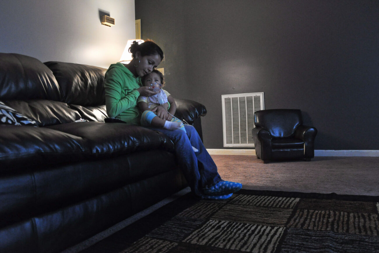 Mimi Ocampo holds her youngest child, Meli, to give her a breathing treatment in her apartment in London, Ky., on the morning of Thursday, Oct. 25, 2012. Meli, who is 14 months old, has allergies and needs the steam treatment many mornings, Ocampo said. Meli was born at 33 weeks and spent 23 days in the hospital in Lexington, Ky., before Ocampo could bring her home. Ocampo visited her daughter everyday she was in the hospital. | Photo by Taylor Moak