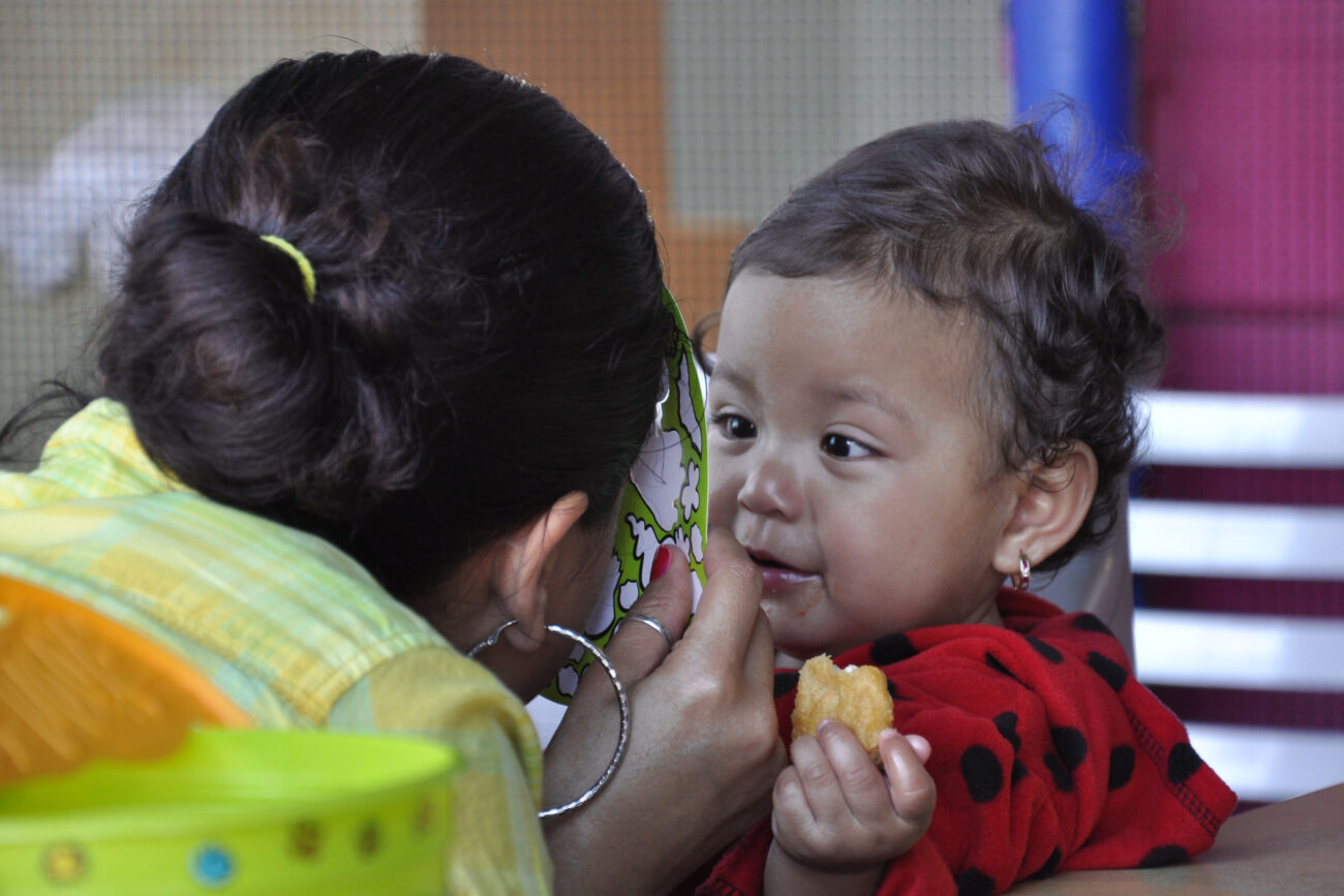 Mimi Ocampo plays with her youngest child, Meli, at a McDonald's in London, Ky., on Wednesday, Oct. 24, 2012. Ocampo had just taken her three kids to the park and stopped by McDonald's to get them dinner. | Photo by Taylor Moak