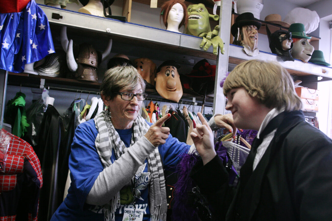 Joyce Lovelace, previous owner of "Dress the Part Costume Shop" in London, Ky., jokes around with her intern, Jonathan Hibbard, on Friday, Oct. 26, 2012. Hibbard is a senior involved with the arts in Laurel County...Photo by Amelia Orwick