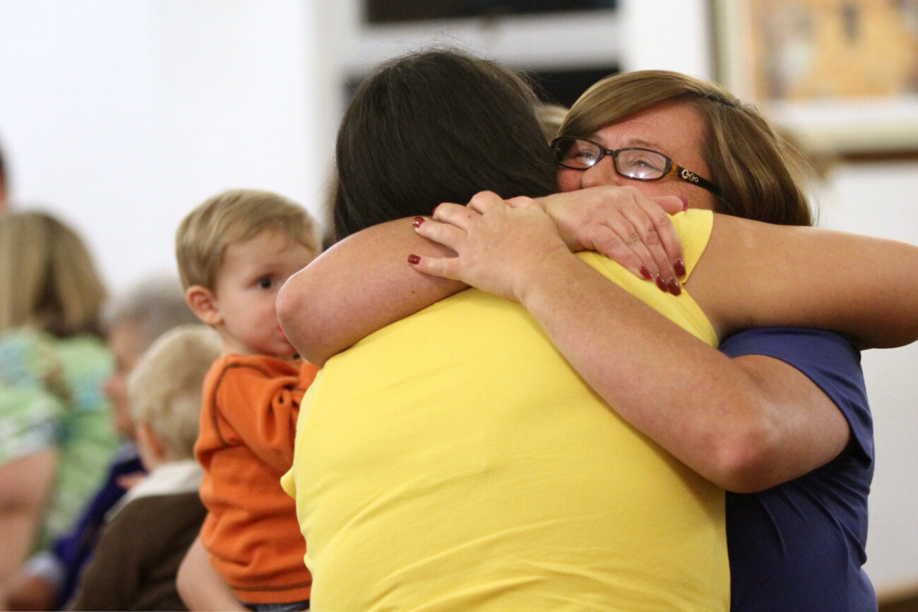 Members of Solid Rock Missionary Baptist Church near Corbin, Ky., hug during fellowship at the Wednesday evening service on Oct. 24, 2012. Photo by Becca Clemons