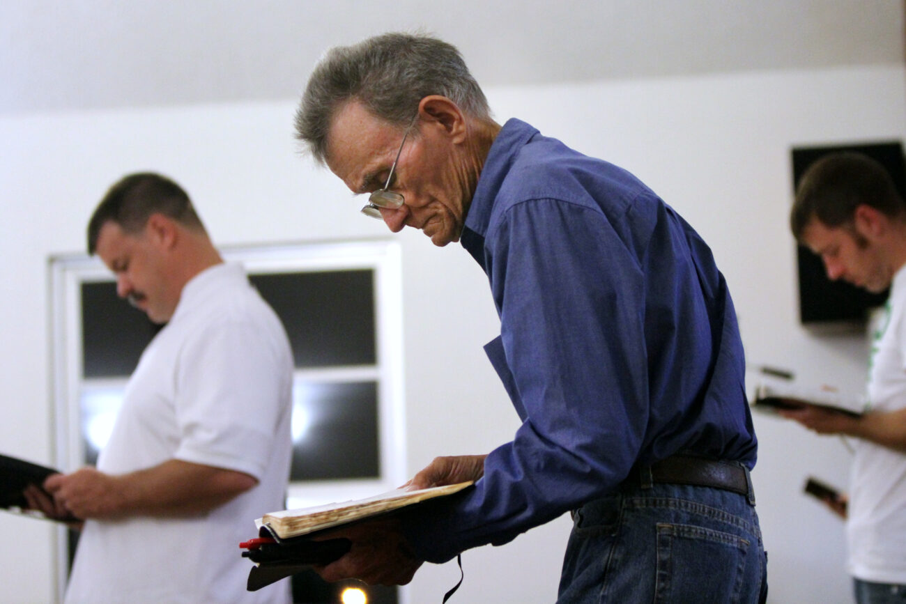 Members of Solid Rock Missionary Baptist Church read along with Pastor Randy Steely's sermon on Wednesday, Oct. 24, 2012, near Corbin, Ky. Photo by Becca Clemons