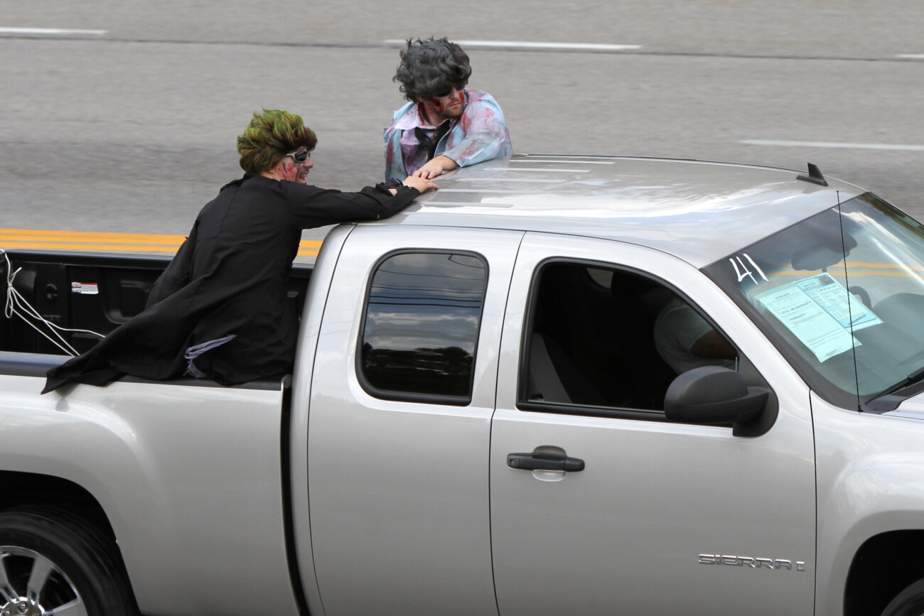 Two men wearing costumes and makeup ride in a the back of a pickup truck near the U.S. 25 and Ky. 192 intersection in London, Ky., on Friday, Oct. 26, 2012. Photo by Becca Clemons