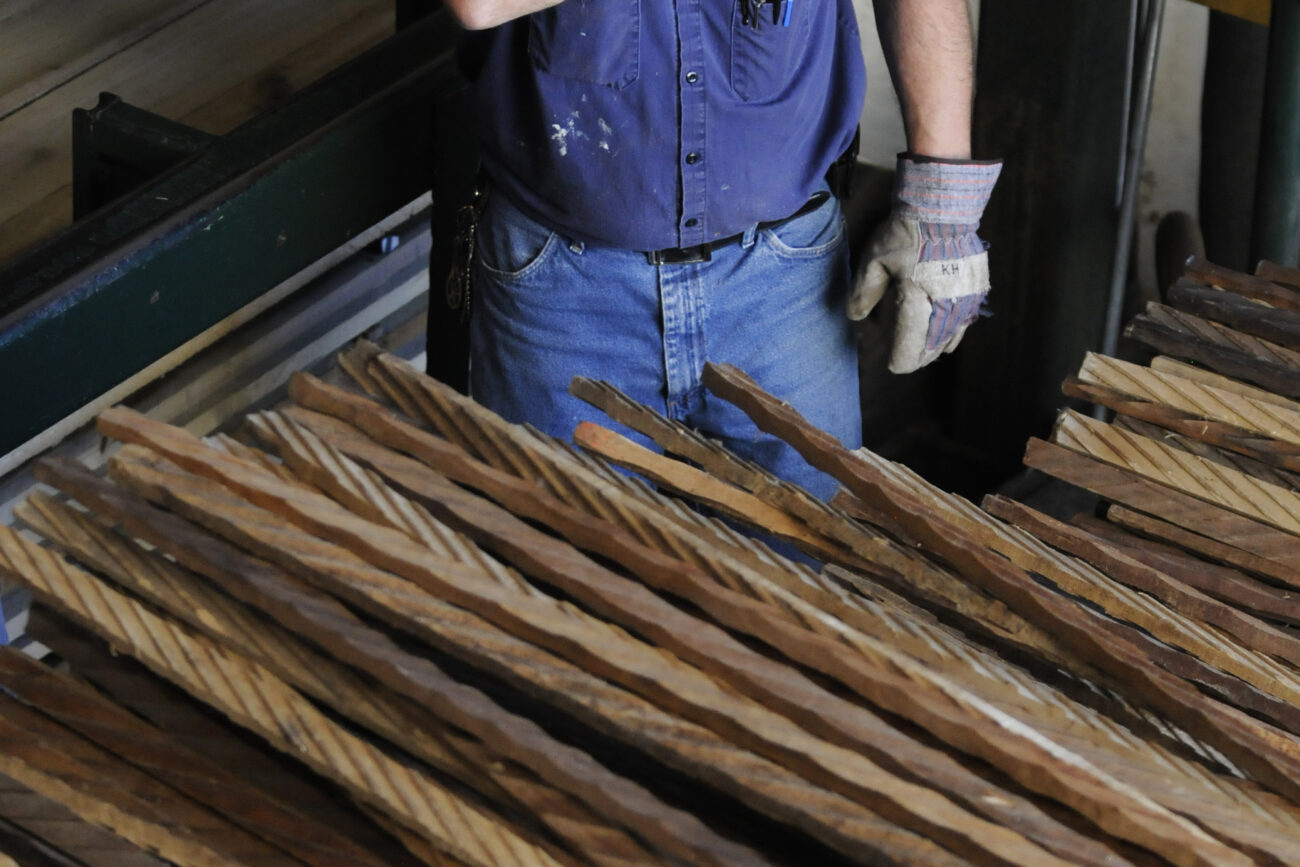 Karl Hubbard, 48, wipes the sweat from his forehead during a lull in the stacking room Thursday afternoon.