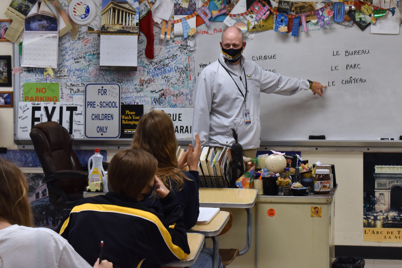 When a teacher is absent, Principal Chris Tracy substitutes for a French class at Franklin County High School in Frankfort, Kentucky, on Friday, Oct. 15, 2021.