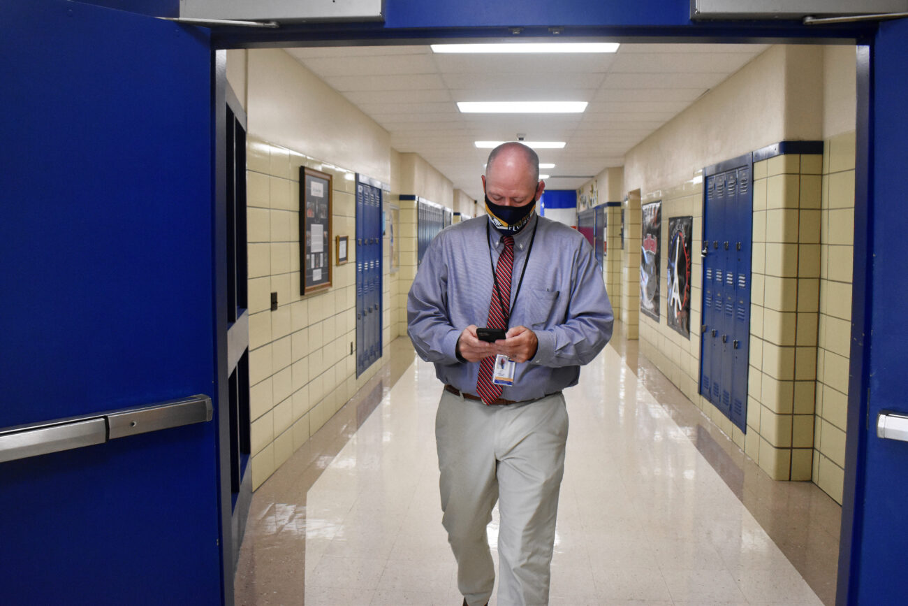 While students are in class, Principal Chris Tracy walks the halls while texting a co-worker at Franklin County High School in Frankfort, Kentucky, on Thursday, Oct. 14, 2021. Ive not been tired in a while, but this week Im really, really tired.