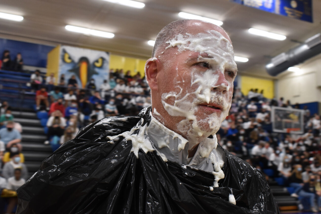 Principal Tracy is covered with whip cream after taking a pie to the face at a pep rally at Franklin County High School on Friday, Oct. 15, 2021.