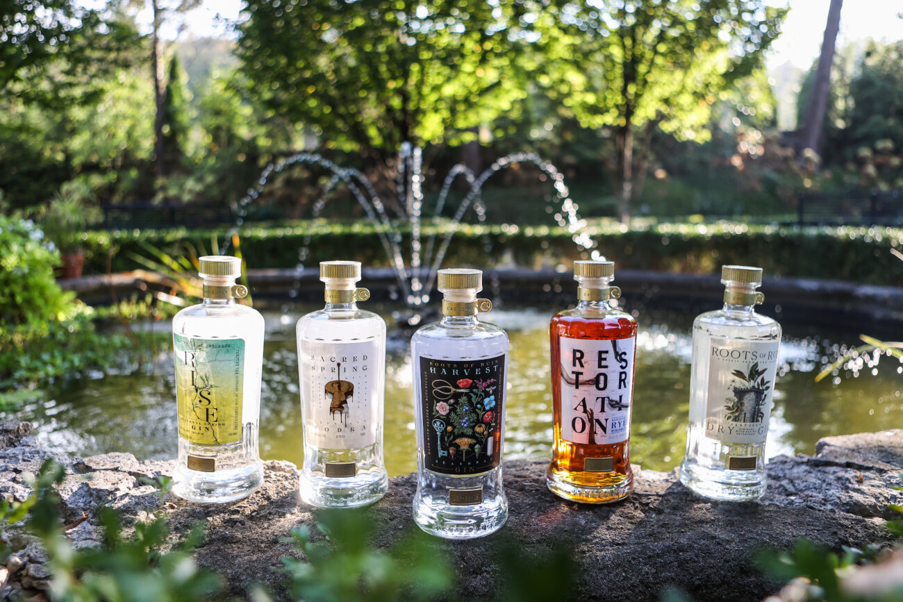 Bottles from Castle & Key Distillery frame a water feature on Thursday, October 14, 2021, in Frankfort, KY.