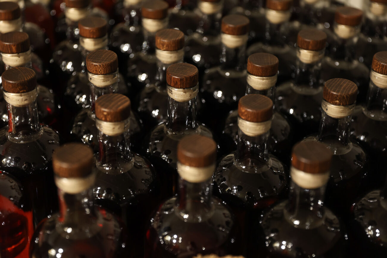 Bottles of Good Times Bourbon sit on a shelf before being labeled on Thursday, Oct. 14, 2021, at Three Boys Farm Distillery in Franklin County, Kentucky. Photo by Jack Weaver