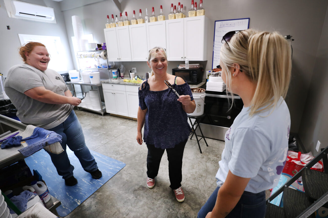 Cook laughs with her ice cream makers Krista Spaulding (left) and Laurie Gonzales (middle) at Taylor Belles production facility on Thursday, Oct. 14, 2021, in Frankfort, Kentucky.