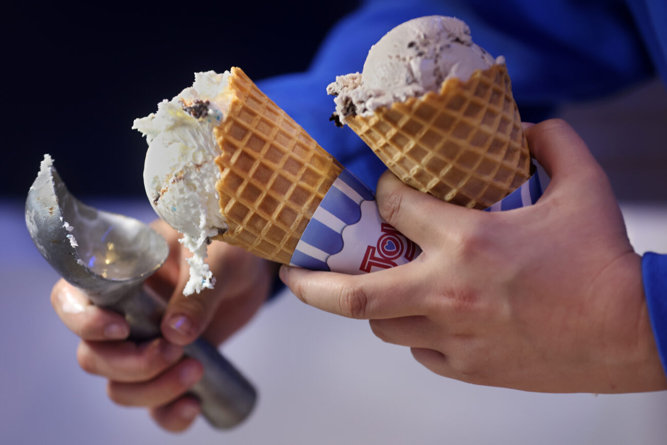 Sydney Stark, Taylor Cooks best friend and worker, serves Taylor Belles ice cream at Rupp Arena during Big Blue Madness.