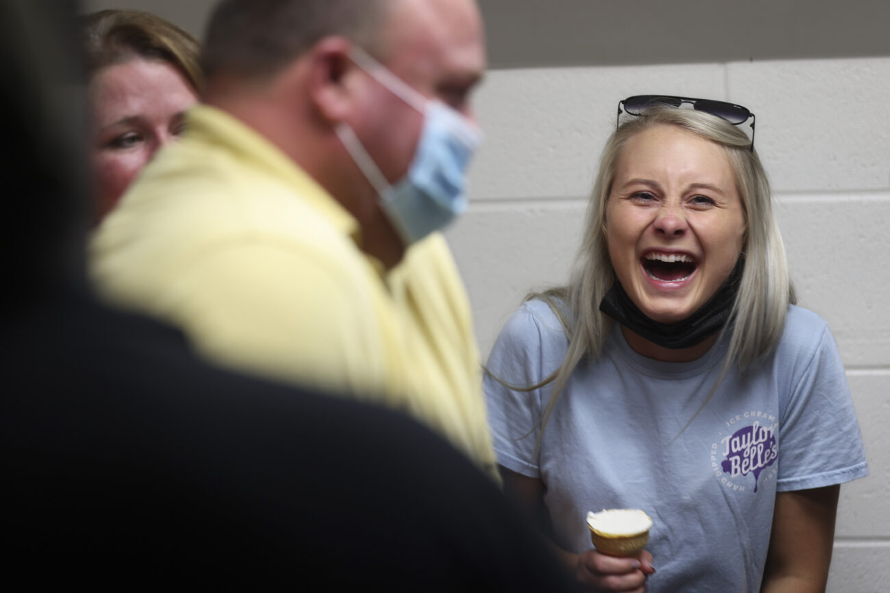 Cook laughs with her workers during a training session ahead of Big Blue Madness at Rupp Arena on Thursday, Oct. 14, 2021, in Lexington, Kentucky.