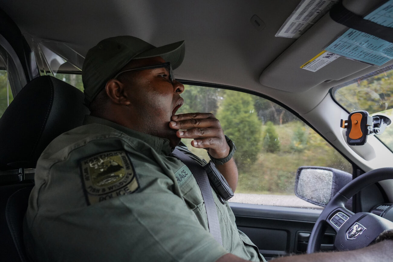 James Brace yawns while driving his Kentucky Department of Fish & Wildlife Resources police vehicle on Friday, Oct. 15, 2021, in Frankfort, Kentucky. Much of Brace’s job involves driving around Frankfort and the surrounding counties, checking fishing and hunting licenses.
“I work the best county in the entire state,” Brace said. “It has everything.”