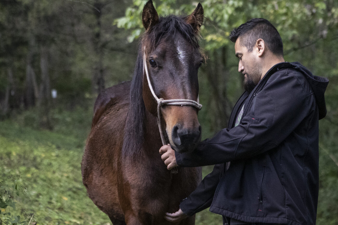 Horacio Lopez shares a moment with his horse at Lopez Land Farm on Saturday, October 16, 2021, in Frankfort, KY.
