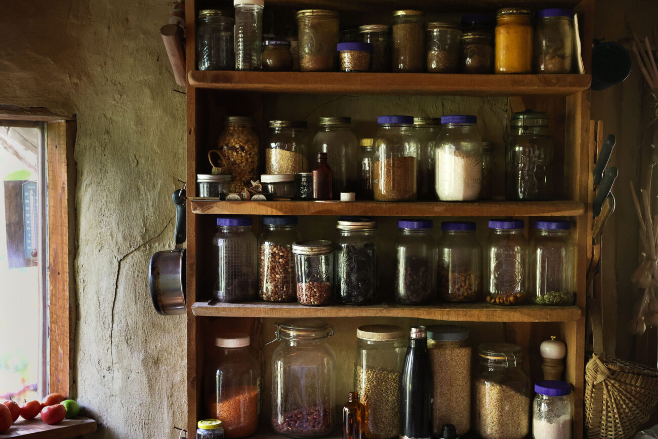 Jars of seeds, nuts and grains Chris Schimmoeller has collected line shelves in her kitchen on Thursday, Oct. 14, 2021, at her home off of Mount Vernon Road in Frankfort, Kentucky. Photo by Jack Weaver