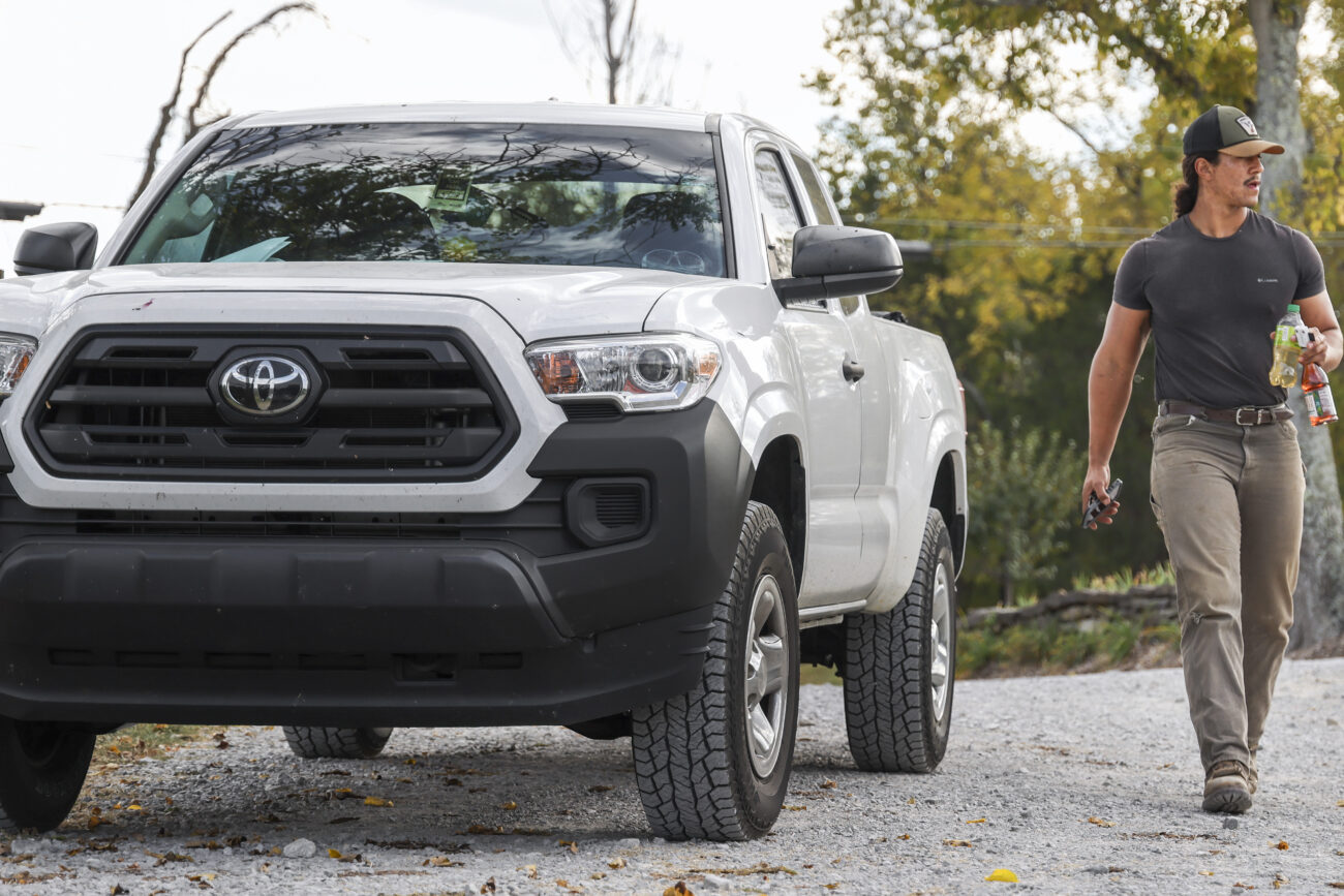 Kentucky State University farm tech and research assistant McKinley Stonewall enter’s West Sixth farm in Frankfort, KY, on Oct. 6, 2022. Stonewall is preparing to go hunting later in the day.