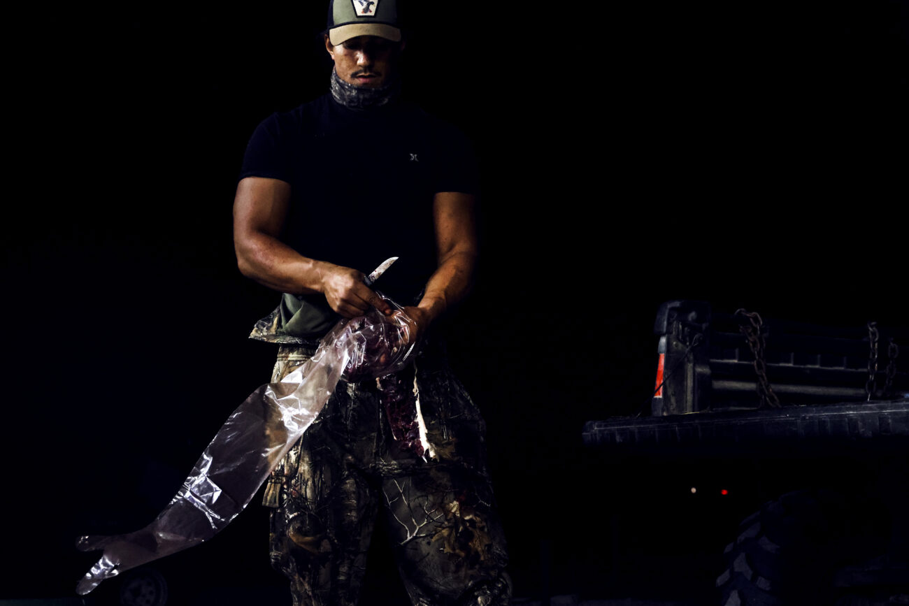 McKinley Stonewall places the meat from his latest deer hunt in a bag to prep for cooking in the coming days, on Oct. 7, 2022, in Frankfort, KY.