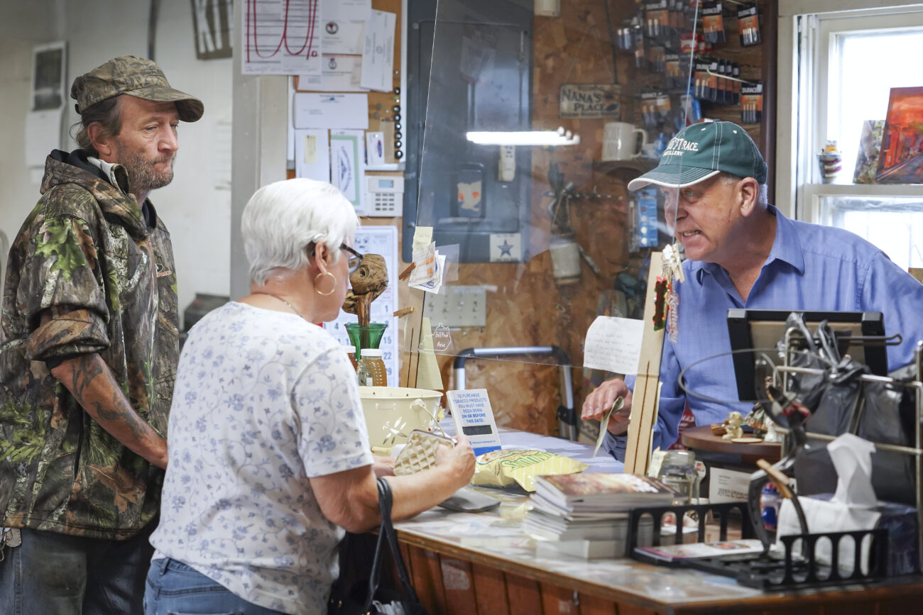 Dan talks to a customer as local Keith “Bean” McDonald waits his turn, in Frankfort, Kentucky on Thursday, Oct. 6, 2022. Photo by Bryce Towle.