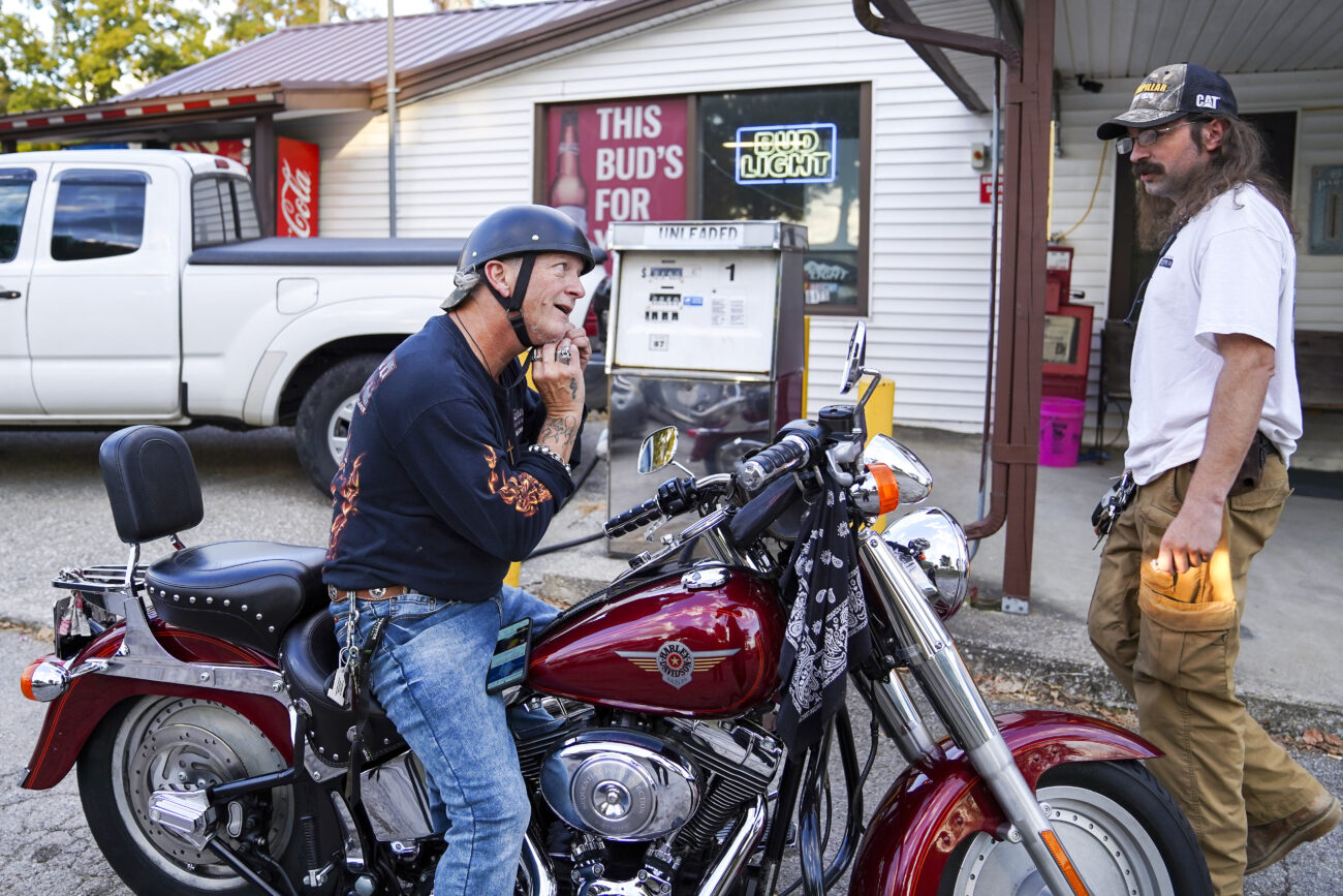 Locals Tim Lawson, and Timothy Fleeman converse outside of Bald Knob Little Market in Frankfort, Kentucky on Thursday, Oct. 6, 2022. Photo by Bryce Towle.
