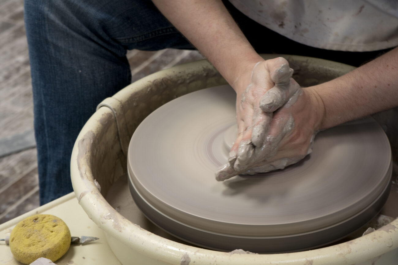 Austen Rothwell works at the pottery wheel at Broadway Clay in Frankfort, Kentucky on Friday, Oct. 7, 2022. Photo | Brooklyn Walters